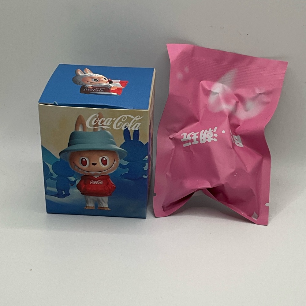 Coca-Cola Figure with Blue Box and Pink Bag surprise RARE